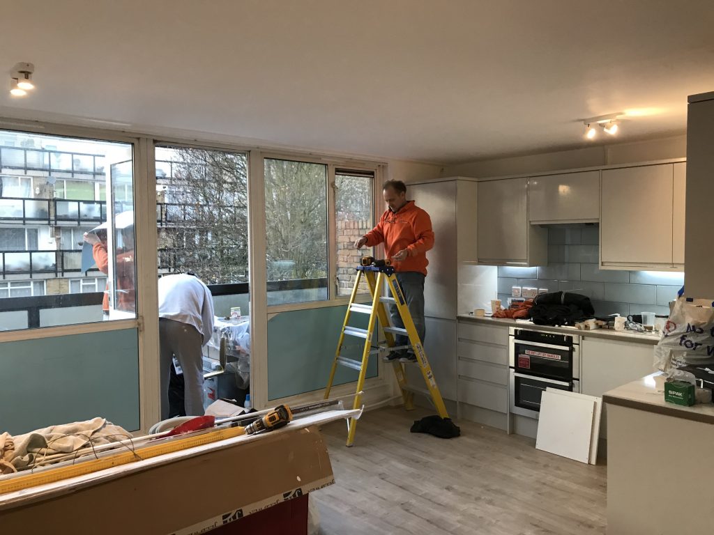 tradesmen working on a kitchen renovation