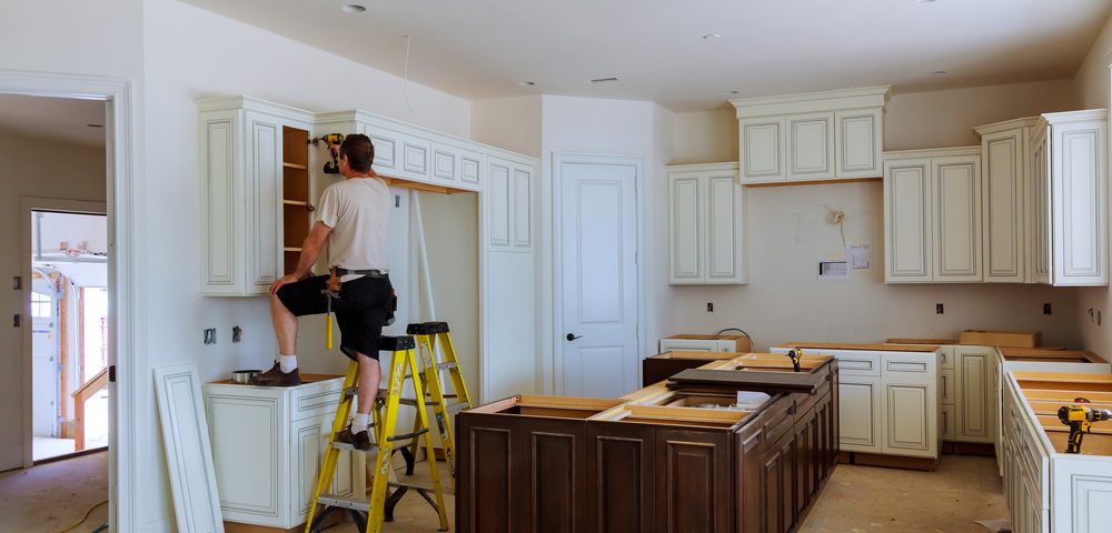 tradesman doing kitchen renovation